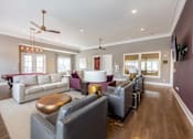 Thumbnail 62 of 197 - A living room with a white couch and a wooden coffee table at Foxwood Apartments, North Carolina