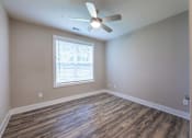 Thumbnail 120 of 197 - A room with a ceiling fan and a window with blinds at Foxwood Apartments, Raleigh-Durham, 27616