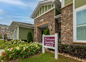 Thumbnail 31 of 197 - A sign in front of a building that says at Foxwood Apartments, North Carolina