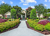 Thumbnail 27 of 31 - A residential area with a pathway and houses.