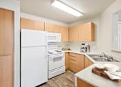 Thumbnail 19 of 24 - kitchen with a white fridge at Desert Eagle Estates, Glendale, 85303