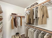 Thumbnail 18 of 24 - walk in closet with wooden shelves at Desert Eagle Estates, Glendale, AZ  