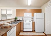 Thumbnail 9 of 24 - kitchen with a white refrigerator at Desert Eagle Estates, Arizona , 85303