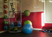 Thumbnail 13 of 15 - Fitness center with yoga balls, medicine balls, yoga mats, small free weights, and resistance bands