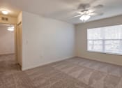 Thumbnail 11 of 24 - Carpeted Room with Window and Ceiling Fan