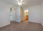 Thumbnail 17 of 24 - Carpeted Bedroom with En-Suite Bathroom and Ceiling  Fan