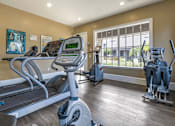 Thumbnail 8 of 24 - Fitness Center Cardio Equipment and Large Window