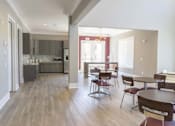 Thumbnail 43 of 197 - A kitchen with a dining table and chairs at Foxwood Apartments, Raleigh-Durham, North Carolina