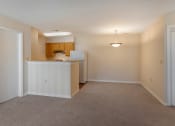 Thumbnail 5 of 31 - Carpeted Living Room Connected to Breakfast Bar off of Kitchen
