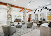 Thumbnail 12 of 33 - a living room with couches and chairs and a fireplace