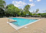 Thumbnail 2 of 29 - A rectangular pool with a slide in the middle.