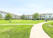 Thumbnail 2 of 25 - Grassy Courtyard with Walk Paths
