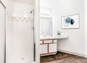 Thumbnail 21 of 25 - Bathroom with Walk in Shower and White Cabinets with Wood Accents