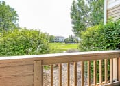 Thumbnail 25 of 25 - Courtyard Views From Private Patio with Wood Railing