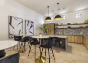 Thumbnail 31 of 39 - a kitchen and dining area in a 555 waverly unit