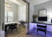 Thumbnail 34 of 39 - a room with a desk and two chairs