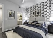 Thumbnail 15 of 39 - a bedroom with a large bed and two night stands with lamps
