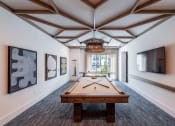 Thumbnail 2 of 58 - a games room with a pool table and a television