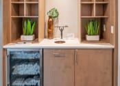 Thumbnail 28 of 58 - a kitchen with a sink and a cabinet with shelves