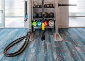 Thumbnail 16 of 58 - a home gym with a rack and hoses on the floor