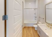 Thumbnail 29 of 58 - a bathroom with a sink and a toilet and a shower