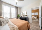 Thumbnail 33 of 58 - our apartments offer a bedroom with a large bed and a living room