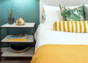 Thumbnail 44 of 58 - a bedroom with blue walls and a yellow and white bed