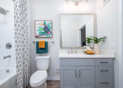 Thumbnail 54 of 58 - a bathroom with a shower and a toilet and a sink