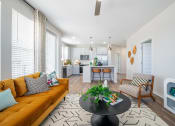 Thumbnail 55 of 58 - a living room with a couch and a table