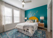 Thumbnail 58 of 58 - a bedroom with a blue wall and a white bed