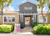 Thumbnail 1 of 44 - the apartments sign in front of a building