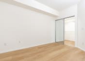 Thumbnail 19 of 44 - an empty room with white walls and a sliding glass door