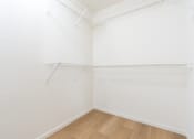 Thumbnail 20 of 44 - an empty room with white walls and a wood floor