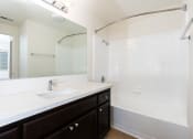 Thumbnail 22 of 44 - the preserve at ballantyne commons apartment bathroom with sink and shower