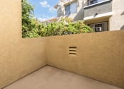 Thumbnail 43 of 44 - a patio with a wall and a window and a balcony