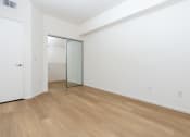 Thumbnail 29 of 44 - an empty room with white walls and a sliding glass door