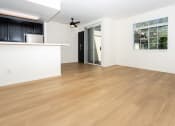 Thumbnail 32 of 44 - an empty living room with hardwood flooring and a window