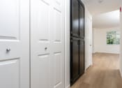 Thumbnail 41 of 44 - an empty room with white walls and a black door