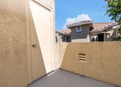 Thumbnail 44 of 44 - an open garage door on a patio with a house in the background