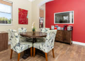 Thumbnail 8 of 44 - a dining room with chairs and a table
