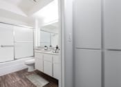Thumbnail 14 of 17 - a bathroom with a shower and a toilet and a sink