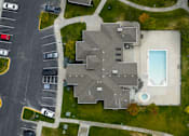 Thumbnail 34 of 36 - A large building with a pool in the middle of it.
