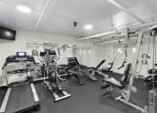 Thumbnail 15 of 20 - Fitness Facilities complete with various exercise equipment and television at King Arthurs Court, Seattle, WA, 98125