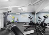 Thumbnail 18 of 20 - a gym with exercise equipment and a yellow exercise ball at King Arthurs Court, Seattle