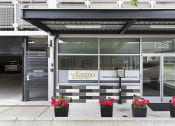 Thumbnail 3 of 22 - the exterior of the property with a black and white checkered tile and plants in front at Villaggio Apartment Homes, WA 98402