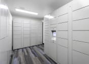 Thumbnail 19 of 19 - a row of white package receiving lockers at Willows Court Apartment Homes, Seattle