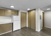 Thumbnail 17 of 19 - Very Spacious kitchen with a white refrigerator and freezer and wooden cabinetry at Willows Court Apartment Homes, Seattle, 98125