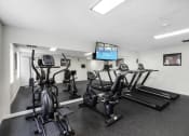 Thumbnail 16 of 19 - Fitness Facilities with mirrored wall at Willows Court Apartment Homes, Seattle, WA