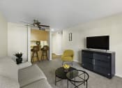 Thumbnail 17 of 25 - a living room with a couch coffee table and a tv on top of a dresser