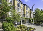 Thumbnail 1 of 27 - a large apartment building with a crane in the background at Sir Gallahad Apartment Homes, Bellevue, Washington 98004